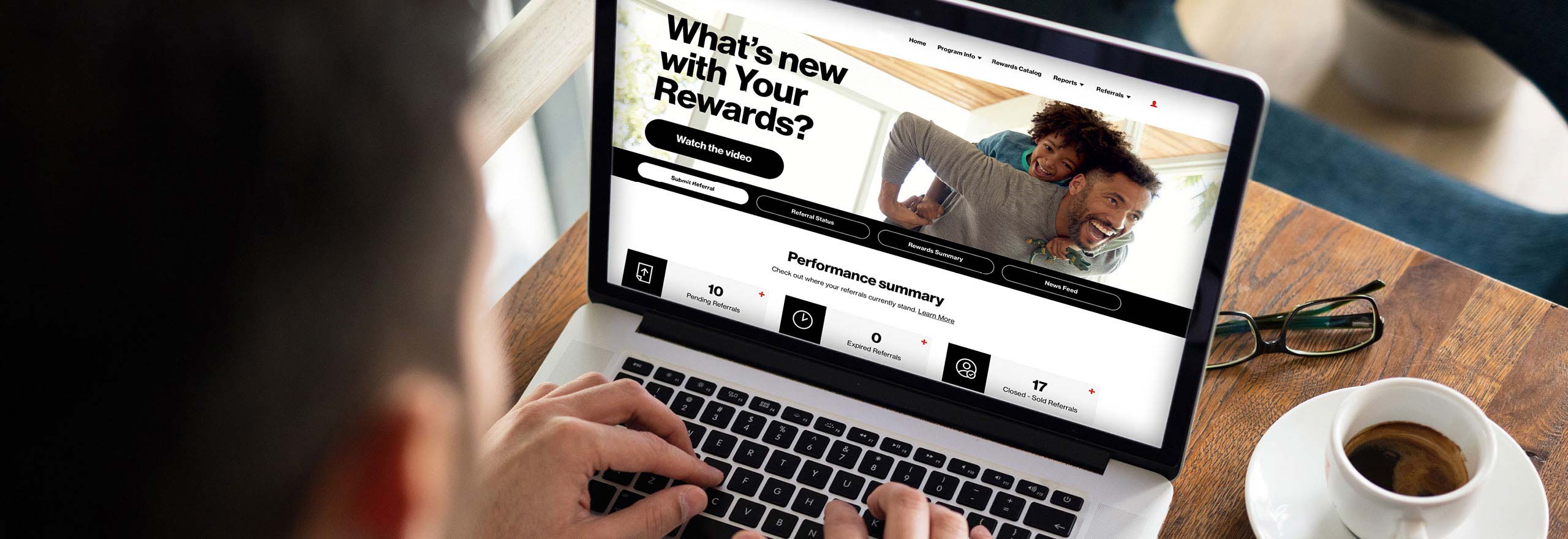 person looking at incentive platform on laptop